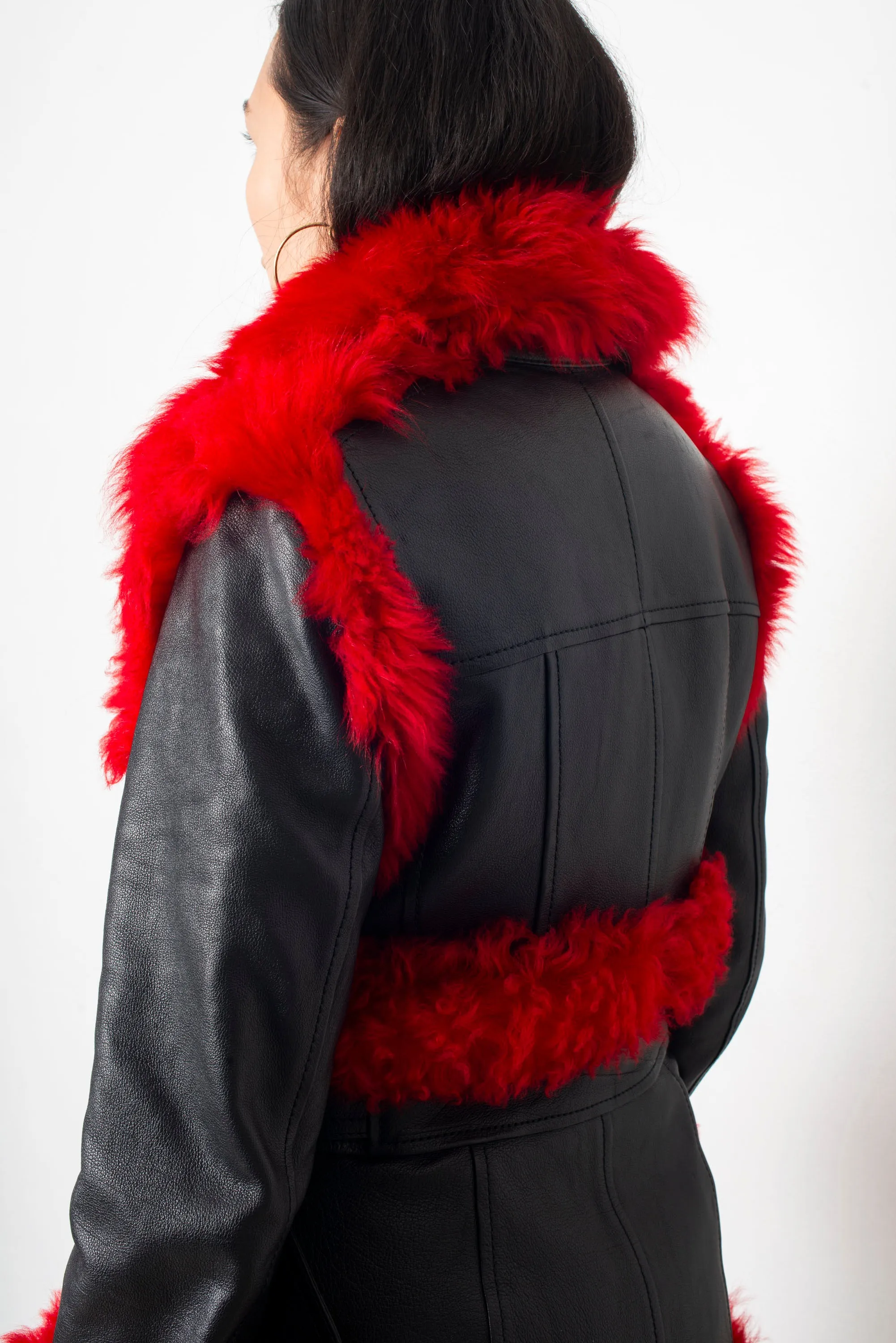 Alexander McQueen FW 2017 black leather and red dyed shearling fur paneled coat