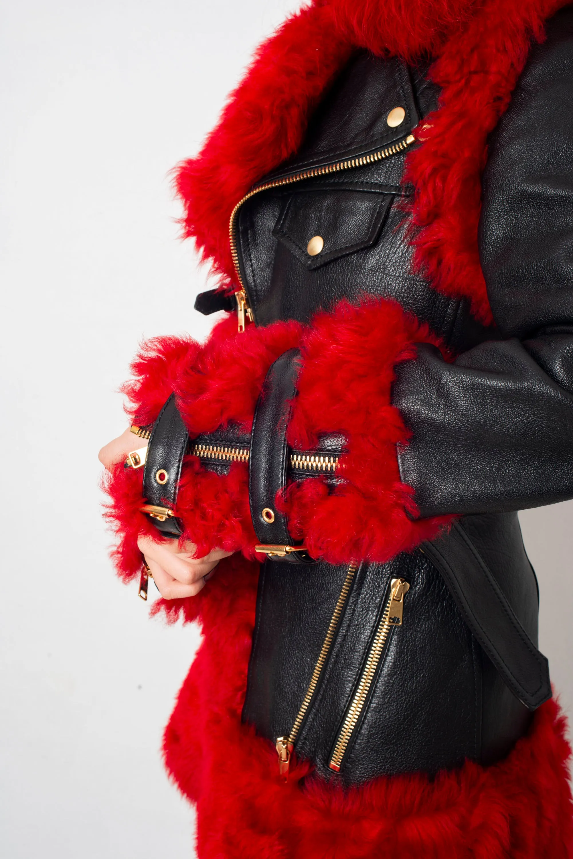 Alexander McQueen FW 2017 black leather and red dyed shearling fur paneled coat